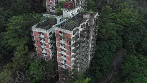 aerial view of old abandoned highland towers in green vegetation at kuala lumpur