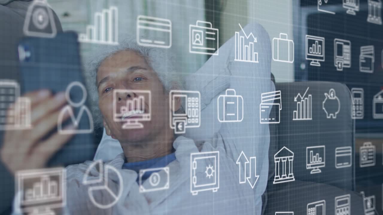 Animation of financial icons over senior woman using smartphone on sofa