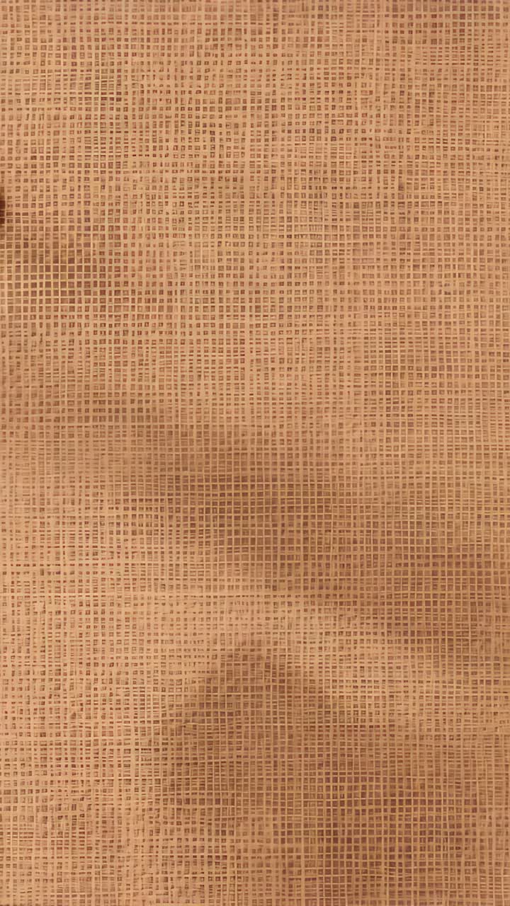 Vídeo vertical: Primer plano de una tela tejida de color canela que se mueve con un ligero paneo de cámara en un estudio, mostrando manchas