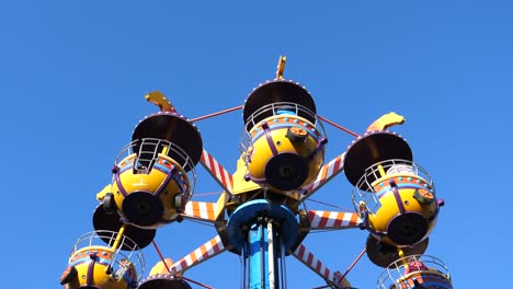 carousel spinning against blue sky