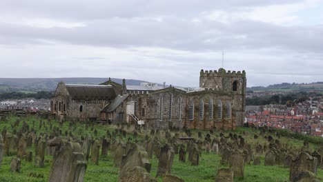 static shot of the old historic cemetery remaining alongside whitby abbey