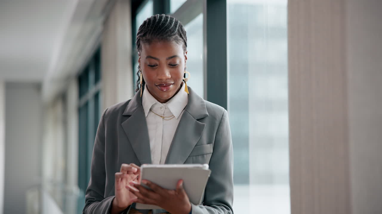 Professional Businesswoman Using Tablet in Modern Office
