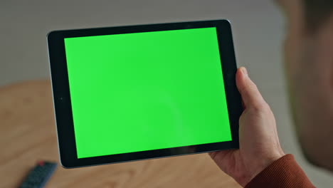 worker swiping chromakey computer cabinet closeup. user scrolling green screen