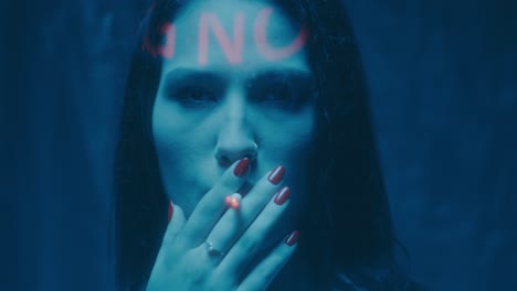 Woman with Neon NO sign, smoking