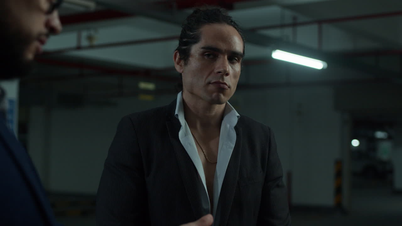 Men counting money in a parking garage