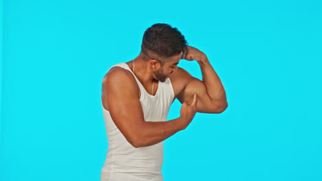 fitness, bicep and man flexing on blue background