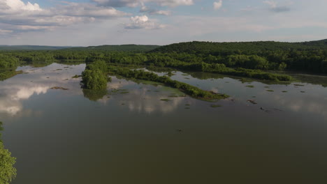 cloud reflections over wetlands of lake sequoyah near fayetteville, arkansas, usa