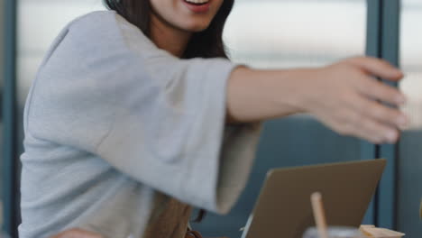 happy business woman shaking hands enjoying partnership deal in successful corporate meeting