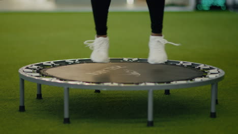 woman jumping on a mini trampoline