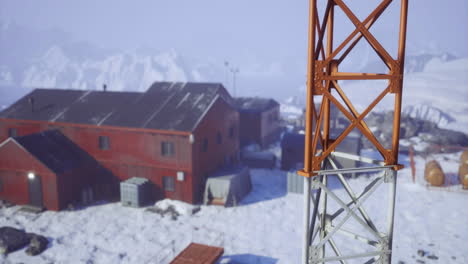 winter landscape featuring a remote research facility in snowy surroundings