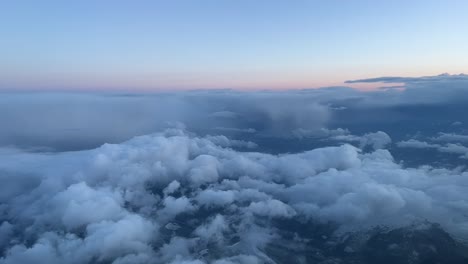 Aerial-cockpit-view-in-a-cold-winter-moornig-with-some-snow-clouds-during-the-approach-to-Bilbao’s-airport