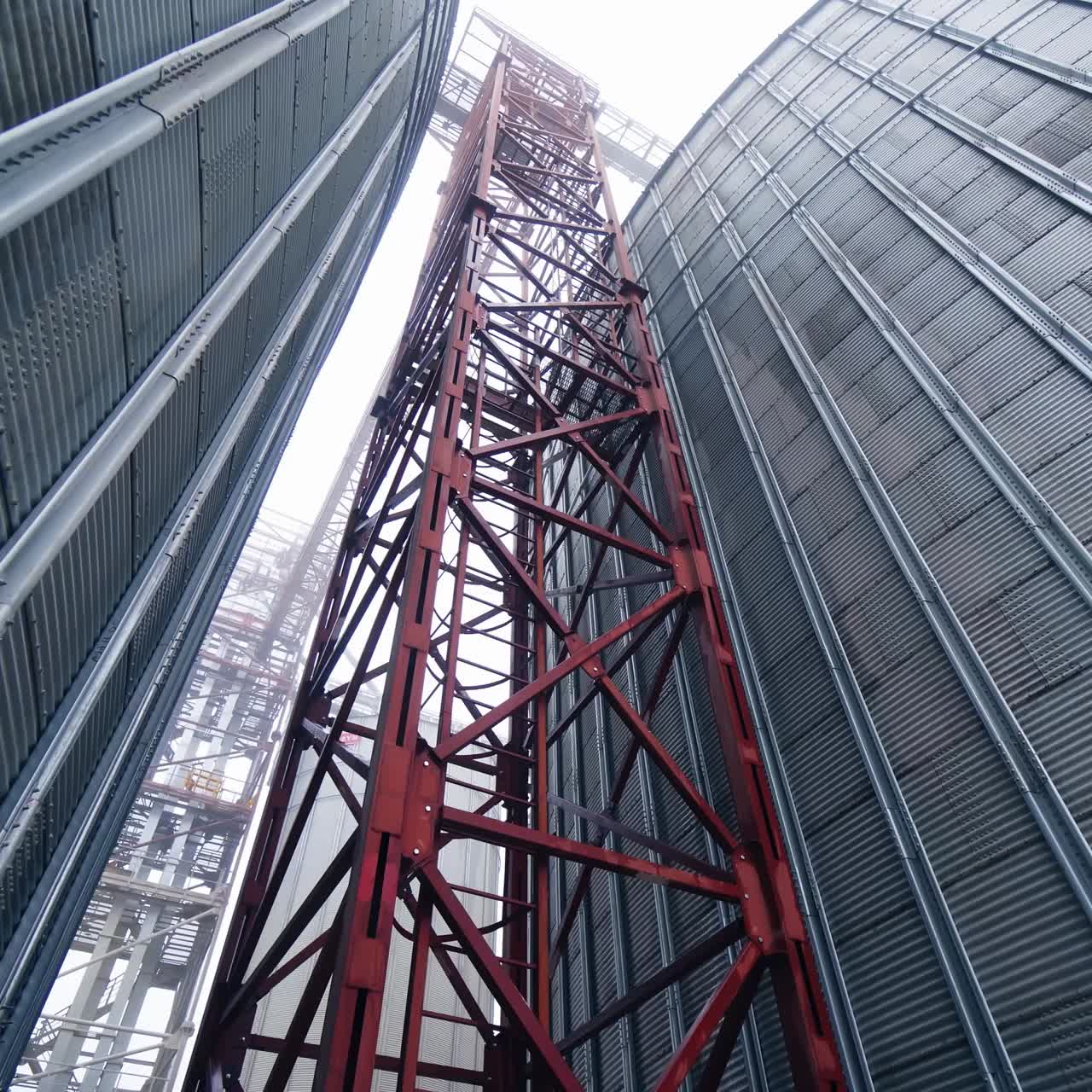 Large gray tanks for grain. Large gray metal tanks for storage of grain
