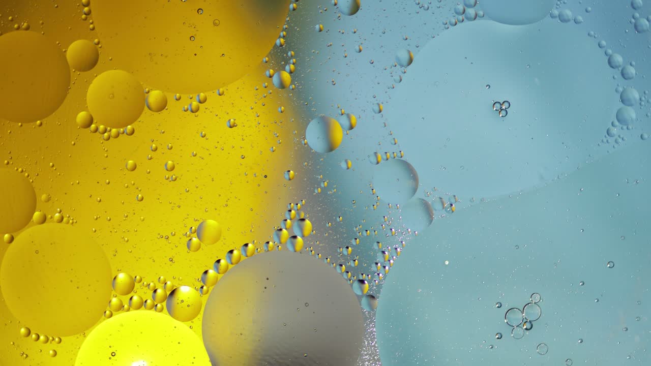 la macroestructura de las burbujas de aceite coloridas. movimiento caótico. fondo multicolor abstracto. patrón