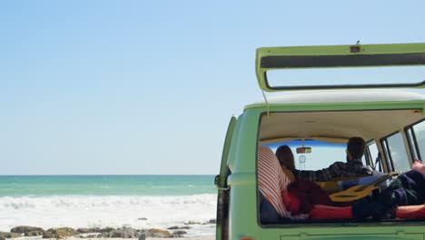 Rear-view-of-couple-sitting-in-a-van-4k