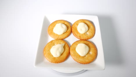 round crackers with mayonnaise