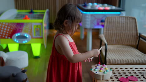 child plays magnetic fishing game in playroom