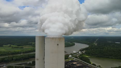 aerial footage of active smokestack at fossil plant