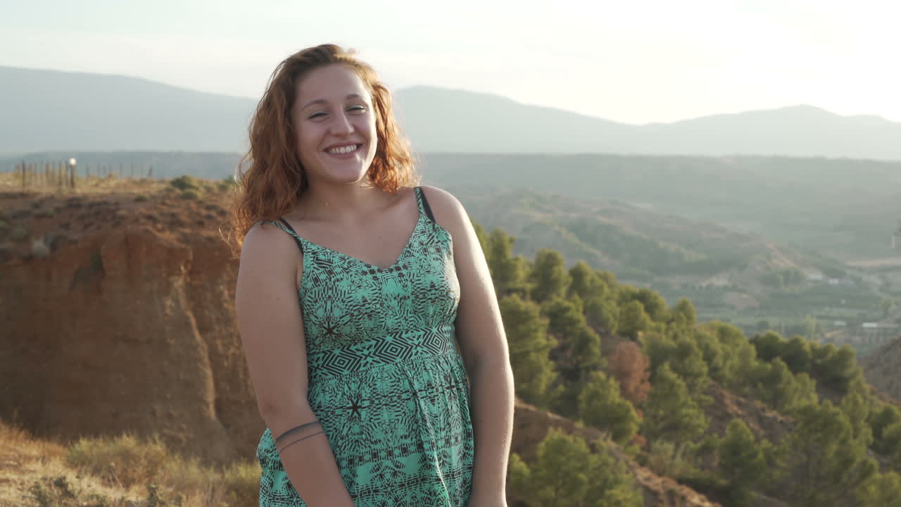 Woman in a dress enjoying nature