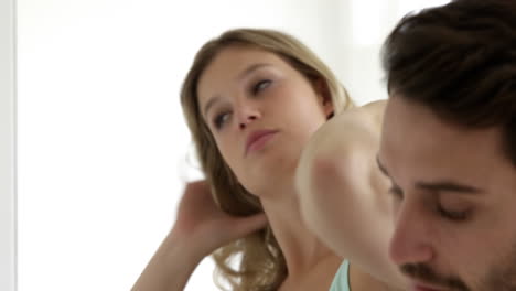 Couple-preparing-together-in-a-bathroom