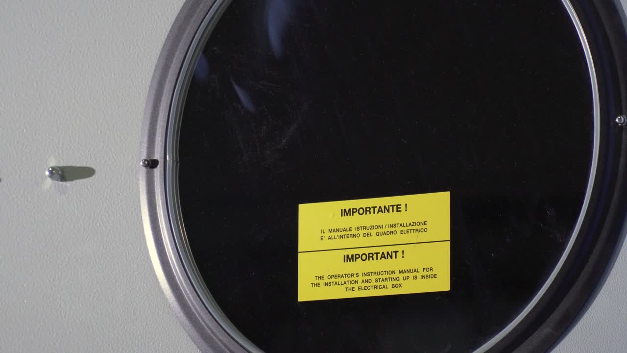 Closeup Of A Industrial Clothes Tumble Dryer Operating