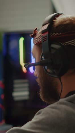 gamer playing on a powerful desktop computer with rgb lighting