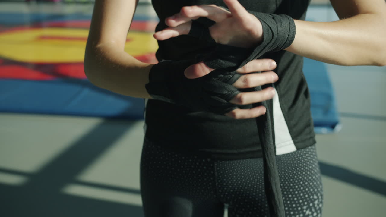 Woman preparing for boxing workout