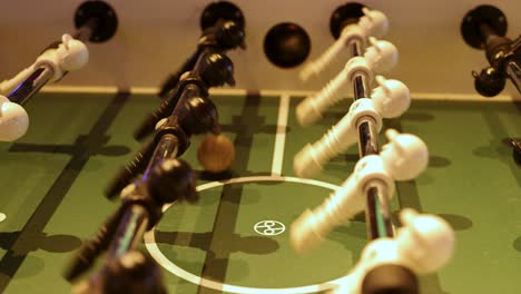 players engage in fast-paced foosball action