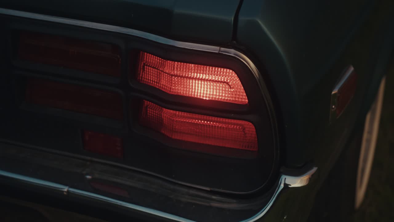 Close-up of a vintage car tail light at night