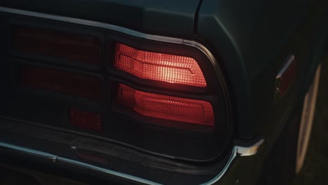 close-up of a vintage car tail light at night