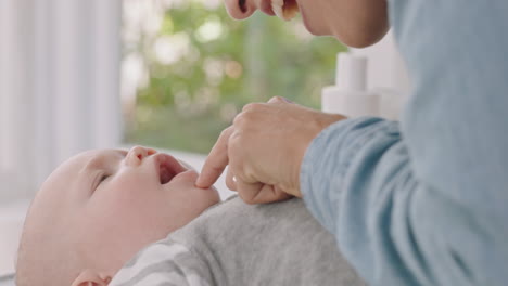 happy mother caring for baby at home loving mom gently kissing toddler soothing her child enjoying motherhood