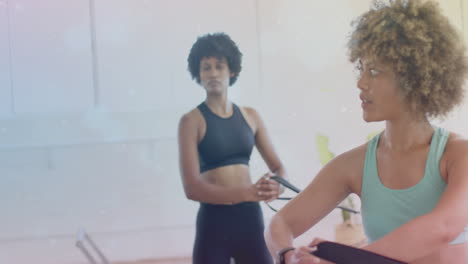 exercising with resistance bands, women in gym over sparkling animation