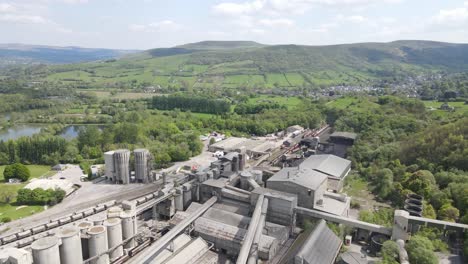 aerial drone flight over of breedon hope cement works with a panoramic view of the surrounding peak district in derbyshire