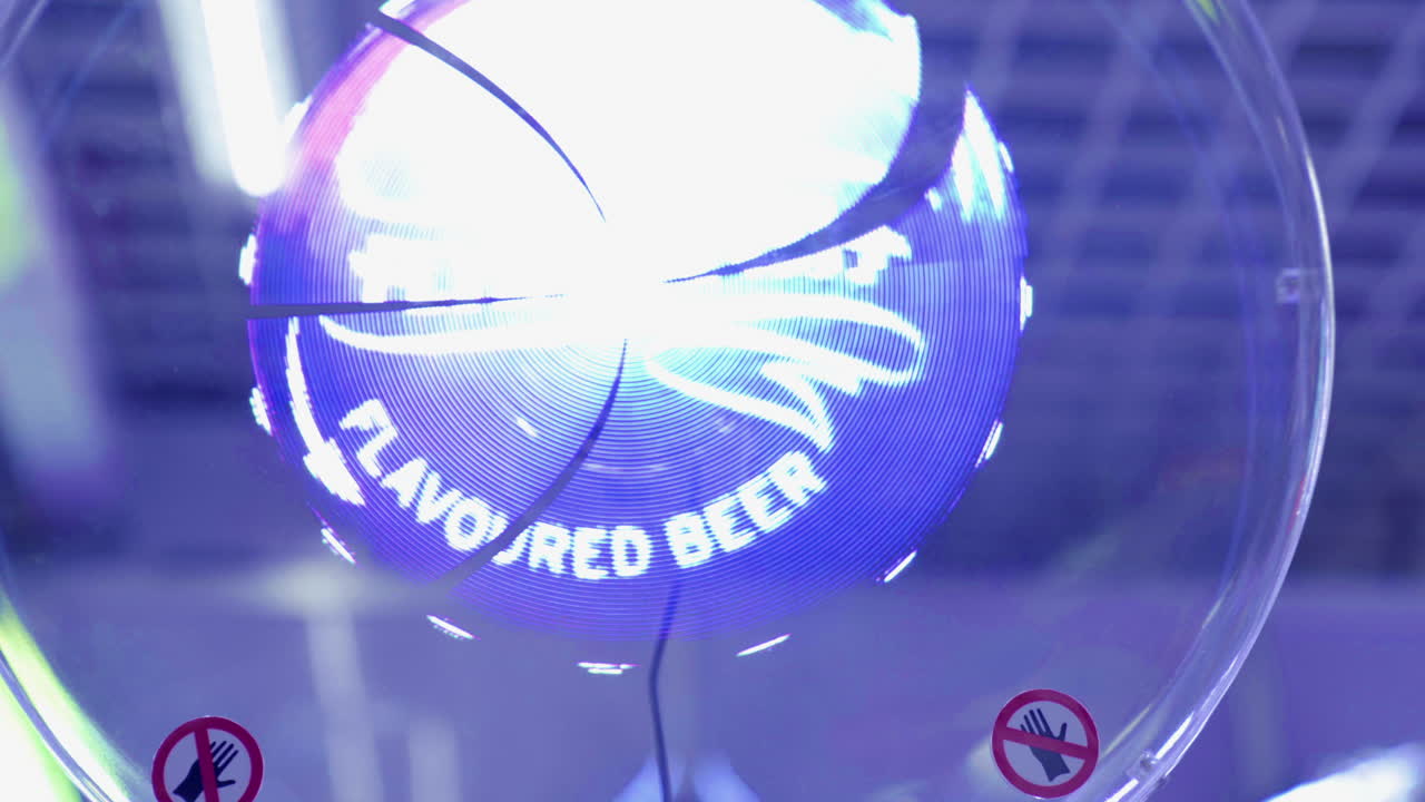 3D Led Holo Fan Advertising Projector Device Displays Floating Hologram Projections of a Beer Bottle and a Cap