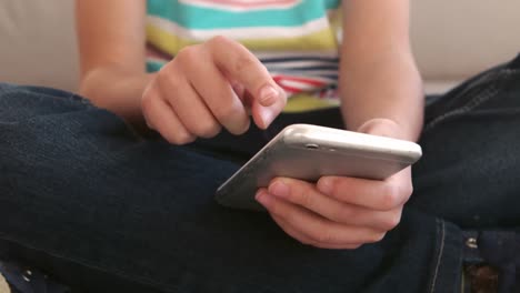 close up of child using a smartphone