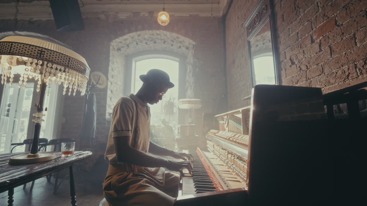 A man playing piano in a vintage cafe