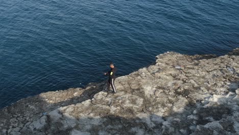 young fisherman on seashore