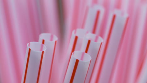 macro close up, red and white plastic drinking straws