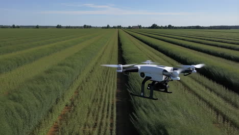 drone flying over a green agricultural field
