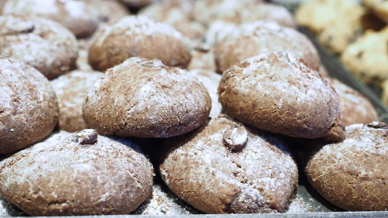 Tray of Brown Cookies with Powdered Sugar and Coffee Beans
