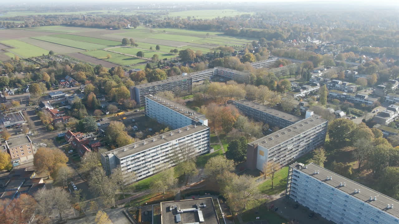 Aerial of distant social housing apartment buildings - drone pulling back