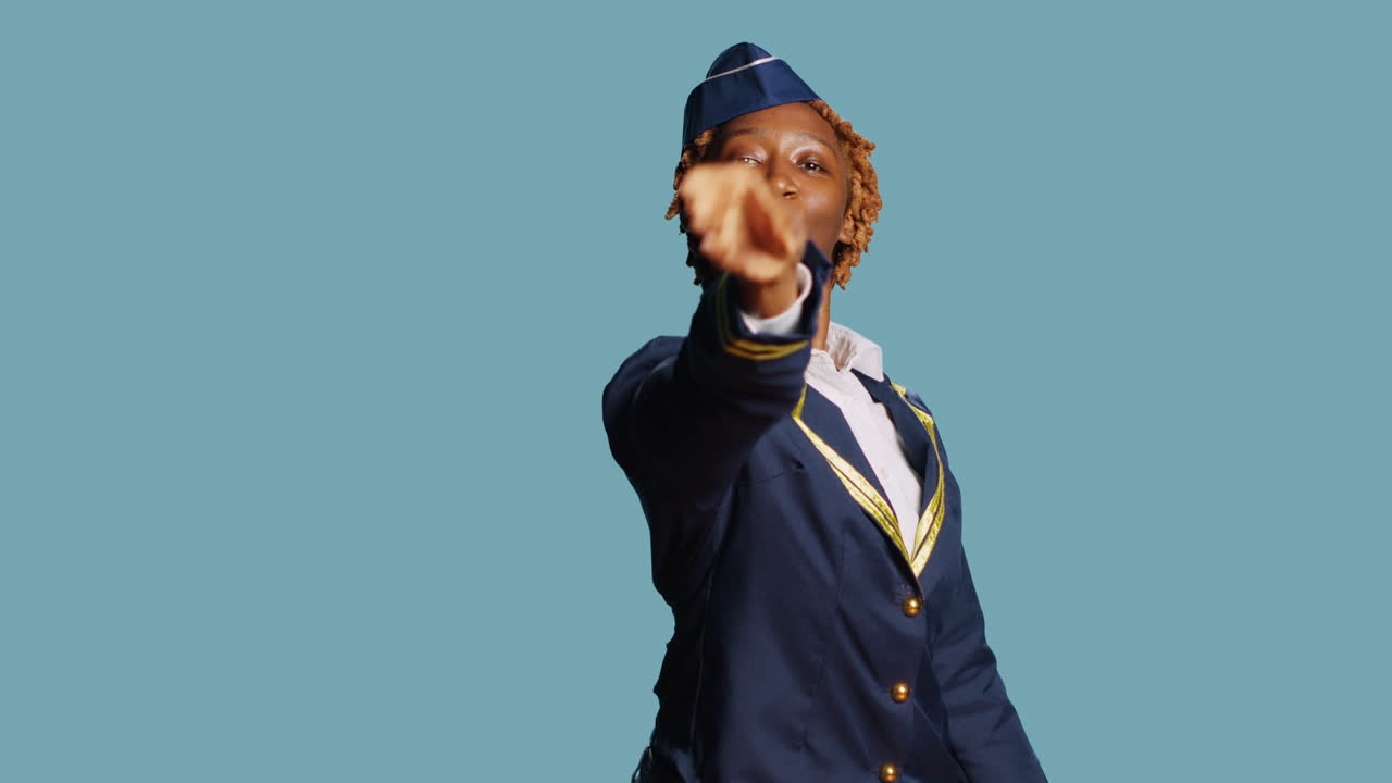 Cheerful silly stewardess playing with paper plane