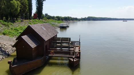 traditional watermill boat navigating the danube in baja, hungary