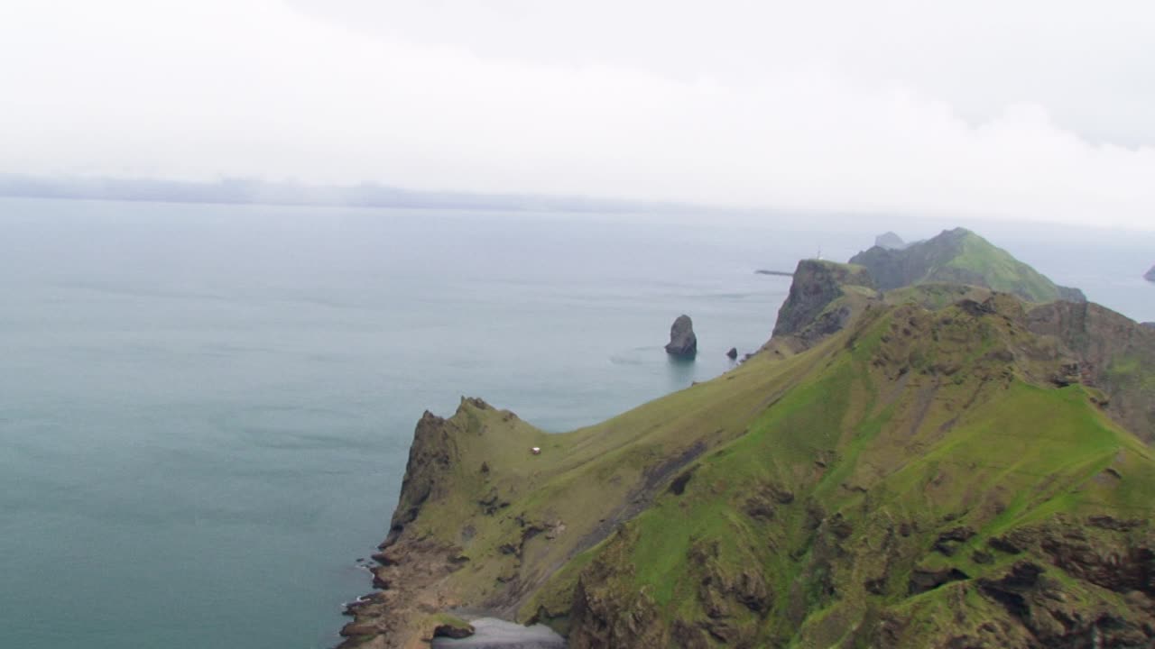 Dramatic Icelandic coastline with cliffs and ocean on a misty day