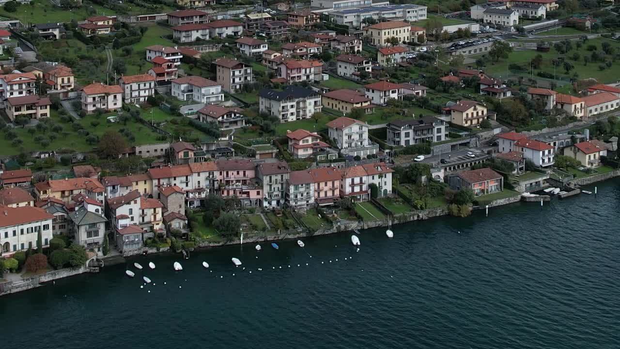Stunning aerial view of Italian Alps by the serene lake and charming homes