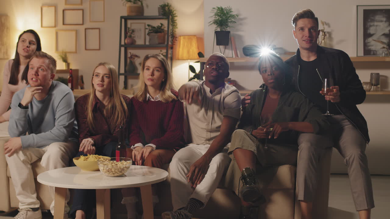 Group of Young People Watching Movie