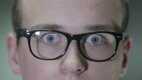 close-up of a young man wearing glasses