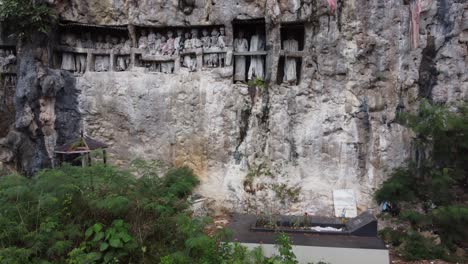 ancient tau tau statues in cliff burials of tana toraja, indonesia