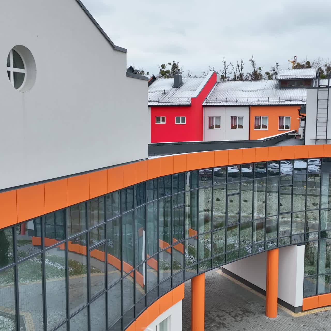Beautiful new building with cupola atop. Colorful design of some parts of the building in mix with white walls