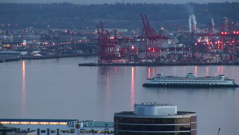 a cruise ship slowly makes its way through seattle's busy harbor in the golden hour