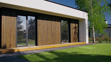 modern house exterior with wooden siding and large windows